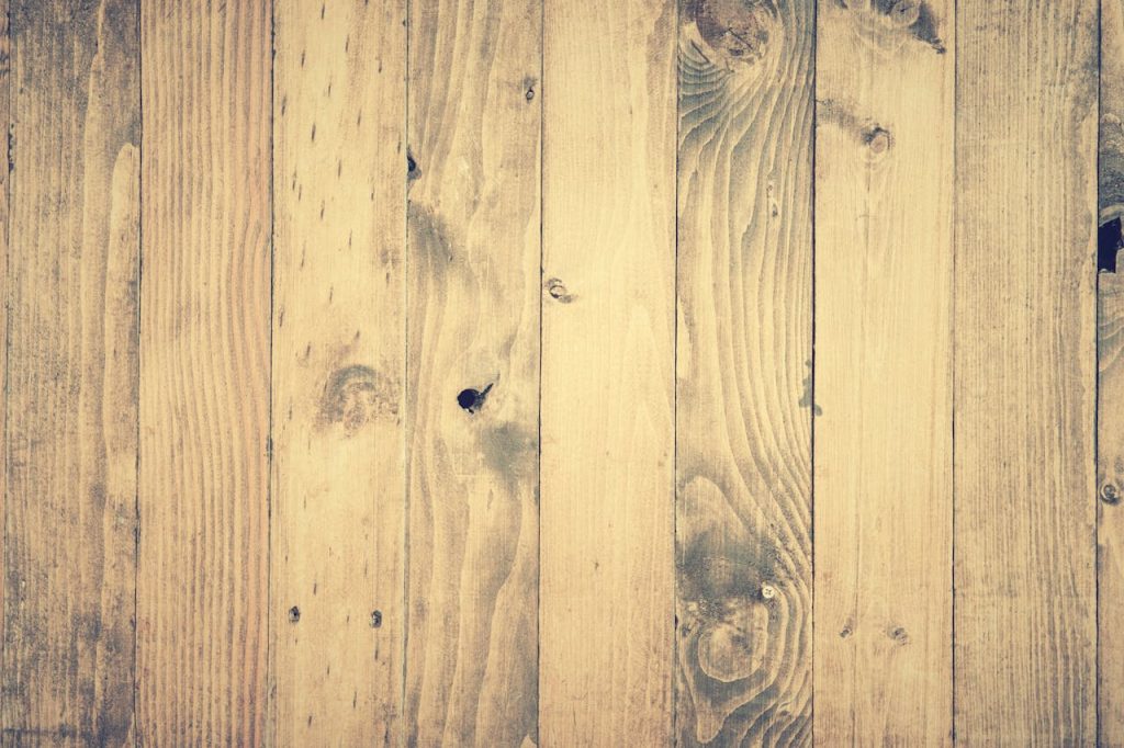 Vintage rustic wooden plank background ideal for design projects or adding texture.